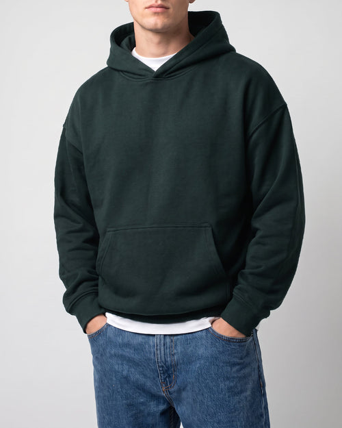 SUTRA olive milton oversized hoodie - front on model