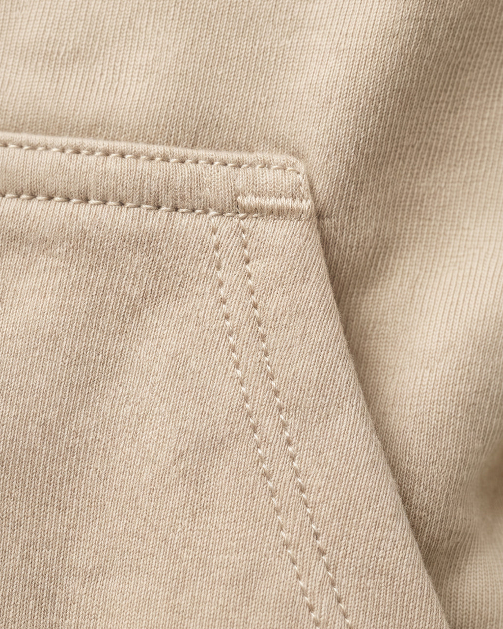 SUTRA beige milton oversized hoodie - pocket stitching close-up