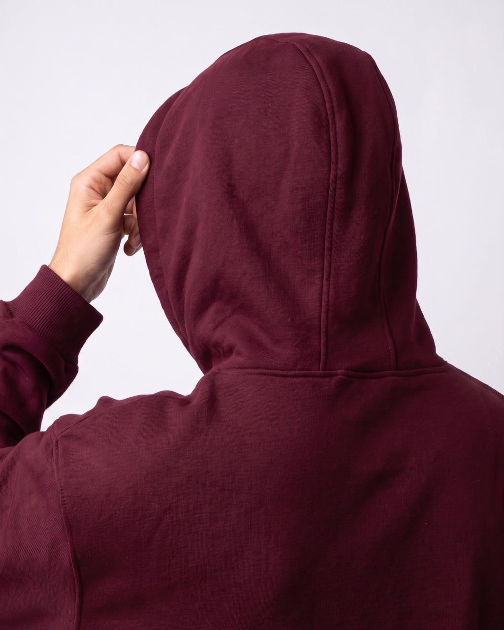 SUTRA wine milton oversized hoodie - hood up on model