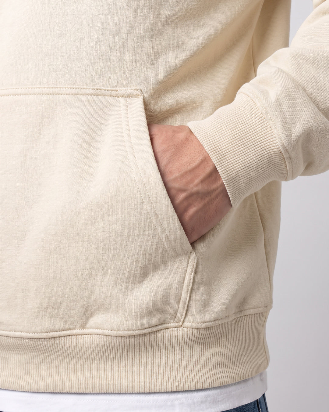 SUTRA beige milton oversized hoodie - kangaroo pocket on model