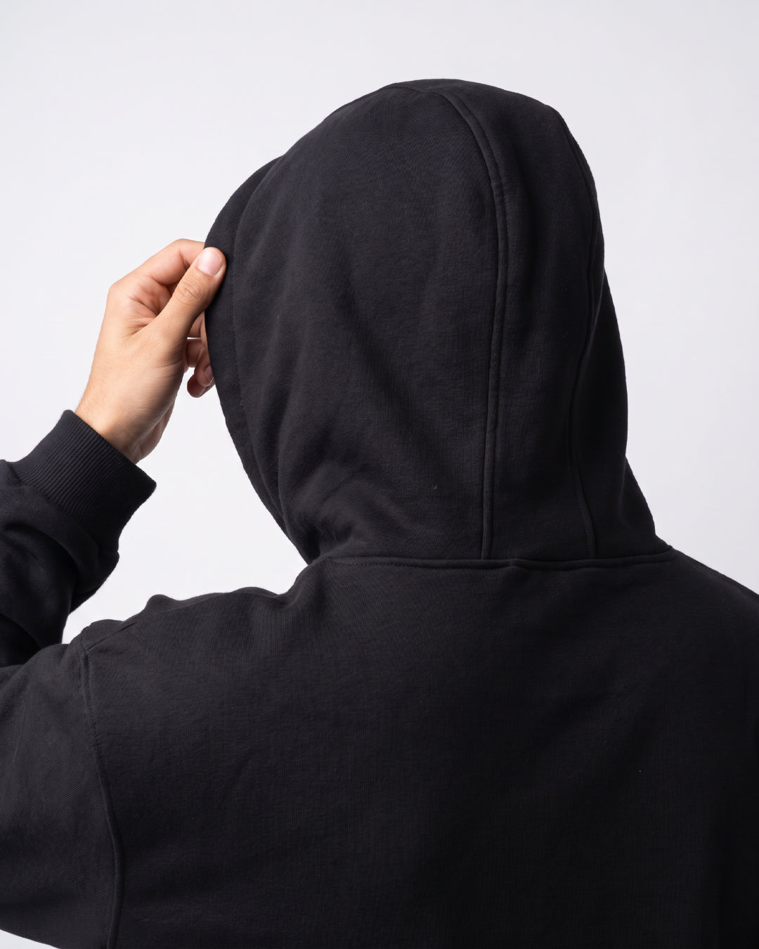 SUTRA black milton oversized hoodie - hood up on model